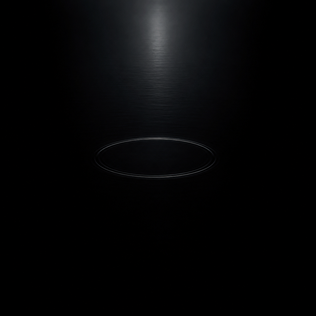 A single ripple on still dark water — visual metaphor for inner stillness